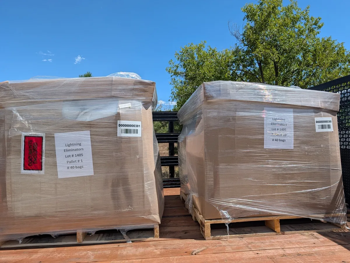 Two shrink-wrapped pallets of Ground Augmentation Fill labelled with lot and pallet numbers, ready for export shipment